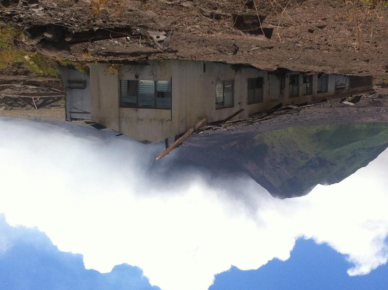 Buried building with volcanic terrain in background